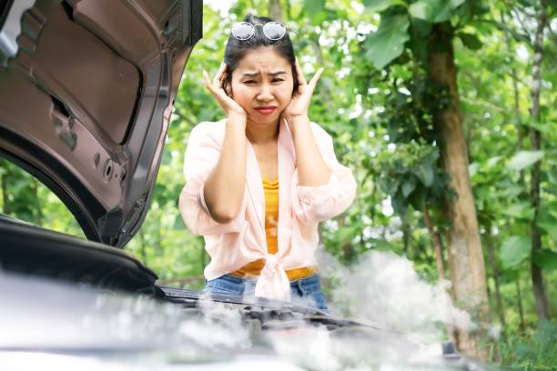What should you do if you encounter a car that is overheating?